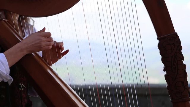 playing harp closeup  Long