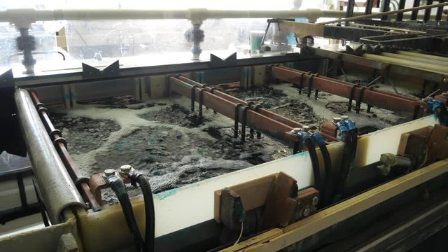 Galvanic bath, Engineering production. Circuit board in galvanic bath in the workflow