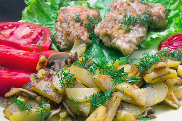 fried chicken with potatoes, mushrooms and chicken
