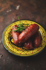 Grilled spanish chorizo with herbs and sauce
