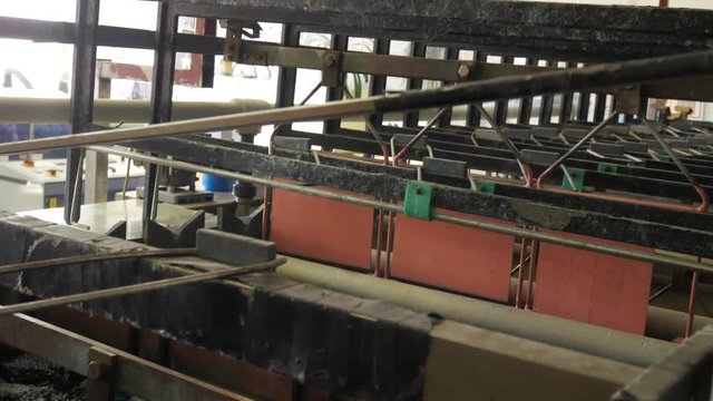 Circuit board manufacturing. Galvanic bath, Engineering production. Circuit board in galvanic bath in the workflow.