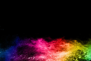 Multicolor powder explosion on black background. 