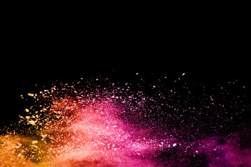 Multicolor powder explosion on black background. 