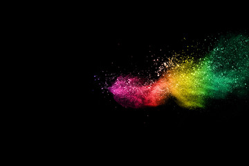 Multicolor powder explosion on black background. 