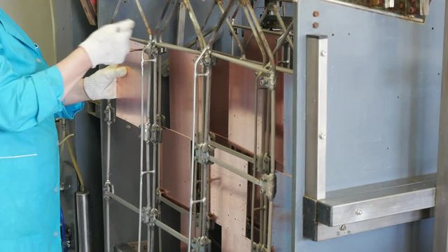 Circuit board manufacturing. Galvanic bath, Engineering production. Circuit board in galvanic bath in the workflow.