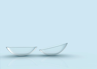 3d rendering. Thin clear contact lens on light blue background.