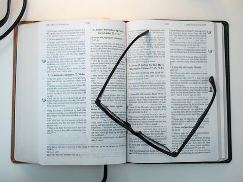 Bible book with glasses