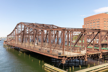 Fototapeta premium Old Bridge next of Seaport Blvd, front of Massachusetts Bay, Boston MA