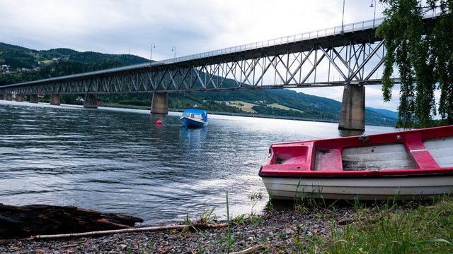Old Boat by the seafont with bridge in background