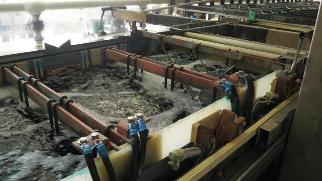Galvanic bath, Engineering production. Circuit board in galvanic bath in the workflow