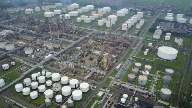 Tilted aerial footage of large petrochemical plant and oil refinery in Indonesia