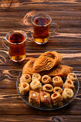 Turkish sweet baklava on plate with Turkish tea.