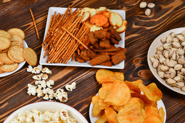 Snacks on a wooden background. Space for text or design.