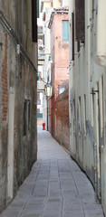 narrow street called CALLE in venetian language with the house i