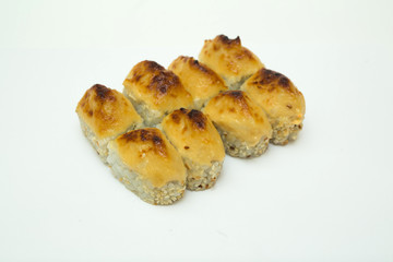 tasty fresh sushi rolls lying on a white background