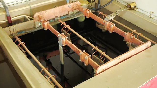 Galvanic bath, Engineering production. Circuit board in galvanic bath in the workflow