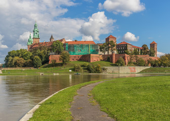 Krakow, Poland - the second biggest city in Poland, Krakow offers a mix of history and modernity. Here in the picture a perspective of the Old Town and the famous Wawel Castle, on the Vistula river