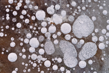 Texture of ice with frozen bubbles.