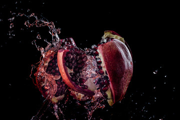 juicy pomegranate shatters into pieces