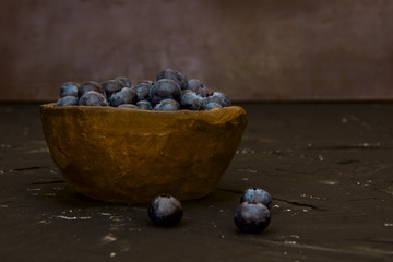 blueberries in a ceramic bowl of clay