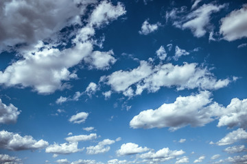 clouds fly on a beautiful, blue sky