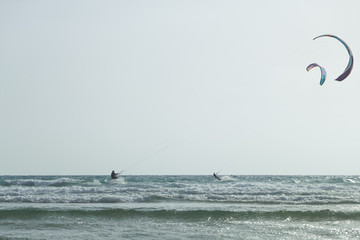 Two man in  Mediterranean Sea beach Netanya kitesurfing. Israel, Netanya,