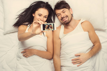 Top view.White married couple making selfie