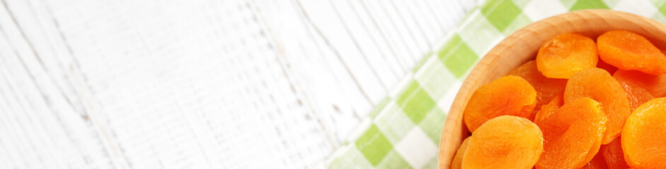 Dried apricots. Banner for website.  The concept is healthy food, vegetarianism, diet,