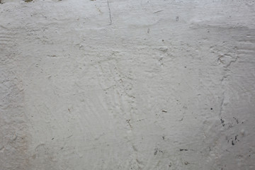 Whitewash painted old wall with scratches texture background.