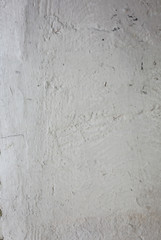 Whitewash painted old wall with scratches texture background.