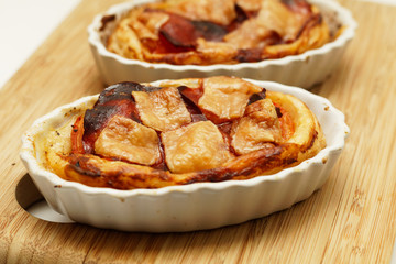 Tartelette with tomatos, chorizo and parmesan