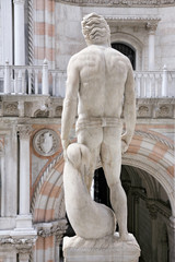 Obraz premium sculpture at the Porta della Carta of the Doges Palace, venice: The doge kneeling in front of Saint Mark's lion, the symbol of Venice
