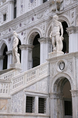 sculpture at the Porta della Carta of the Doges Palace, venice: The doge kneeling in front of Saint Mark's lion, the symbol of Venice
