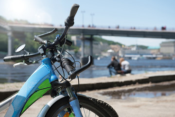 Bicycles on a background the river and foot-bridge. Close-up