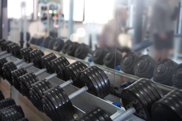 Naklejka na ściany i meble Rows of dumbbells in the gym