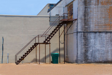metal stairs leading to the second story of an old building