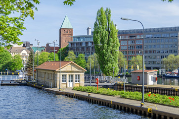 Multi-chamber Muehlendamm locks in the central Mitte district of Berlin with the tower of the...