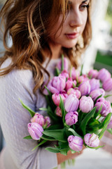 Bouquet of tulips in hands.