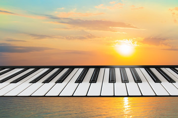 Composition of piano keyboard on marine background.