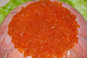 caviar with red fish - seed or trout on green lettuce salad as side dish. healthy food and...