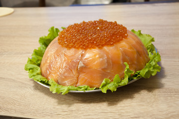 caviar with red fish - seed or trout on green lettuce salad as side dish. healthy food and...
