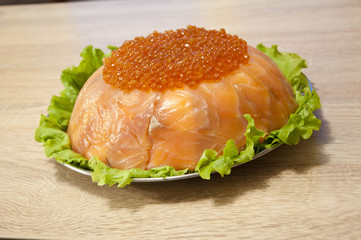 caviar with red fish - seed or trout on green lettuce salad as side dish. healthy food and culinary. cuisisne. dieting and eating. molecular kitchenю delicacy and luxury. restaurant serving
