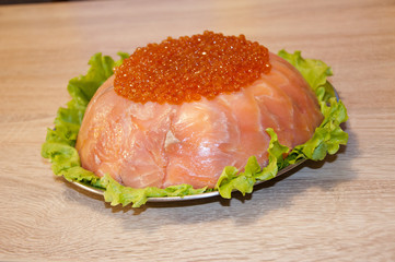caviar with red fish - seed or trout on green lettuce salad as side dish. healthy food and culinary. cuisisne. dieting and eating. molecular kitchenю delicacy and luxury. restaurant serving