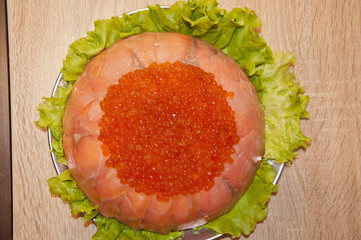caviar with red fish - seed or trout on green lettuce salad as side dish. healthy food and...