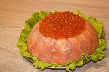 caviar with red fish - seed or trout on green lettuce salad as side dish. healthy food and...