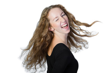 Happy girl with flying blond hair on a white background.