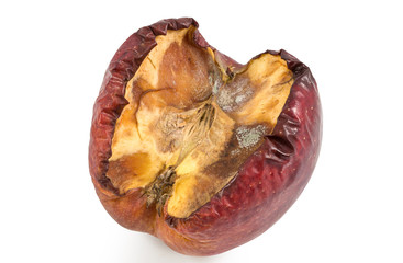 Red moldy apple or rotting apple as concept of skin problems, isolated on white background with...