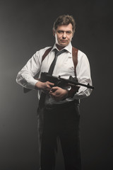 Handsome middle aged detective man with gun