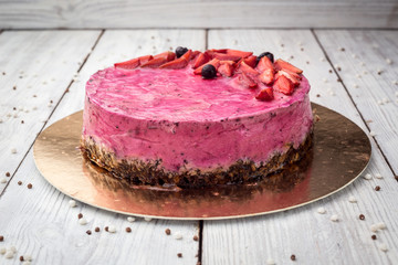 Strawberry Cake dessert with vanilla cream on wooden background