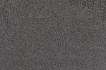 Background texture fragment of furniture upholstery black close-up.